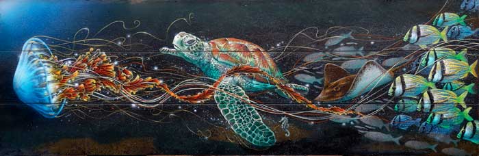 Jellyfish with loggerhead sea turtle and fish school